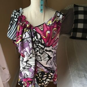Colorful butterfly print  blouse with ruffle over one side and down the front.
